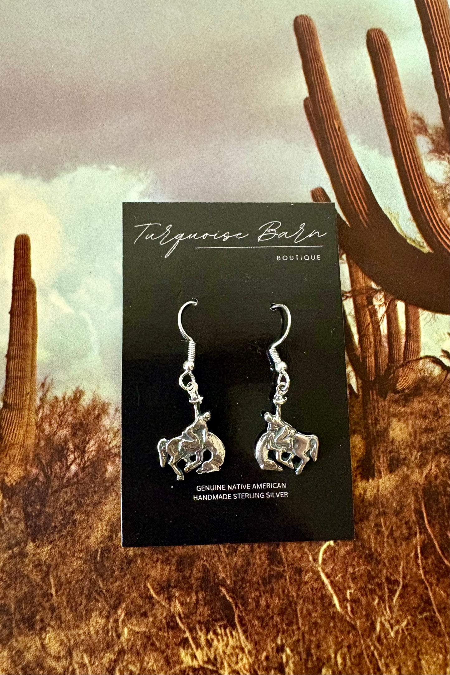 Silver Bronc rider dangle earrings